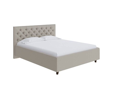 Кровать с мягким изголовьем Teona - Кровать с высоким изголовьем, украшенным благородной каретной пиковкой.